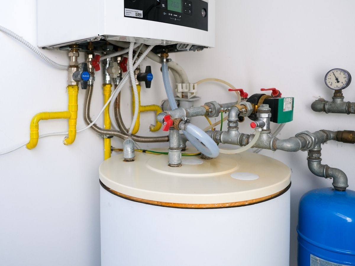 Tank water heater and wall mounted boiler with gas and water piping