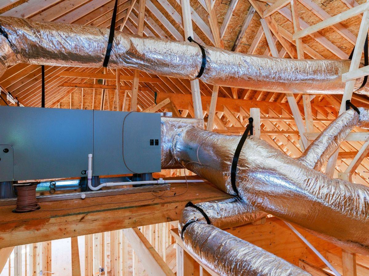 New insulated ductwork and air handler installed in an attic