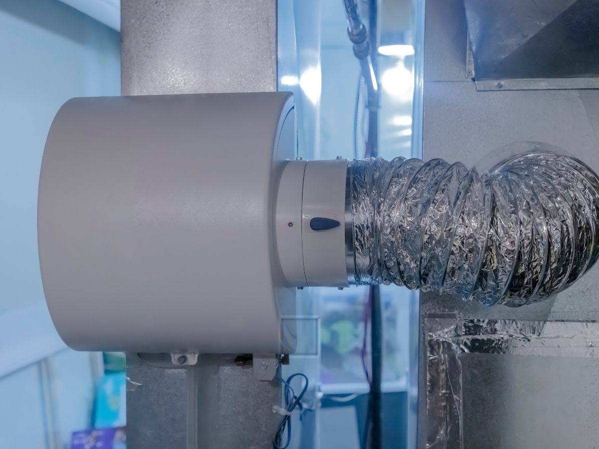 Whole home humidifier connected to a furnace with flexible ductwork